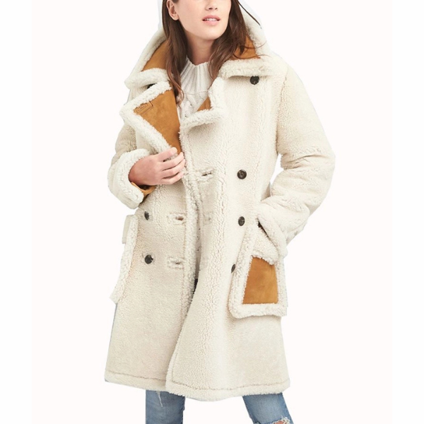 The Women’s Double Breasted Shearling Leather Coat is the epitome of luxury and comfort, offering a refined winter essential that combines warmth with timeless fashion. Crafted from premium fur on the outside, this coat showcases a chic, textured appearance that exudes elegance. The interior is lined with soft suede leather, ensuring both durability and comfort, making it perfect for cold-weather outings. Designed with a lapel collar and a front double-breasted button closure, this coat embodies a classic silhouette that never goes out of style. The long sleeves finished with button cuffs add a polished detail, while the two waist pockets offer practicality and warmth for your hands. The striking white and brown color combination enhances its sophisticated appeal, allowing it to stand out effortlessly in any wardrobe. Whether layered over formal attire or paired with casual winter ensembles, this coat is a versatile piece that elevates any outfit. Ideal for both day and evening wear, it seamlessly balances function and style. From its premium construction to its modern yet classic design, this Women’s Shearling Suede Leather Coat is a must-have outerwear piece. Stylish and warm, it’s the perfect Double-Breasted Shearling Coat For Women—a true statement piece. Upgrade your winter wardrobe with this Women’s Double Breasted White And Brown Suede Coat and step out in confidence.